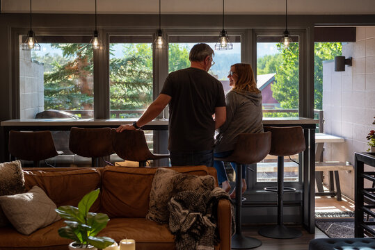 Backview of couple relaxing at home