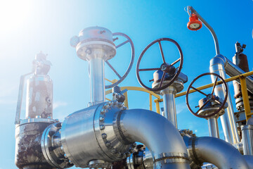 The gate valves on the background of the blue sky.