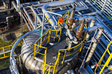 Two safety valves and process equipment are located at the top of the process column. Top view.