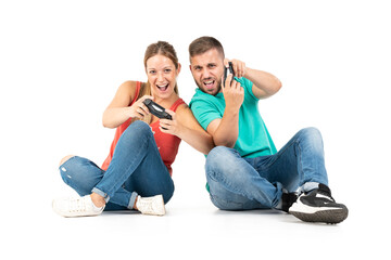 A young couple playing videogames with a controler on a white background