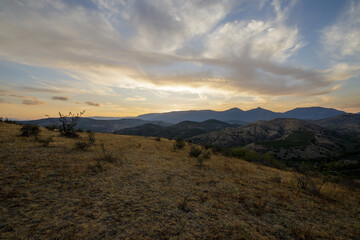 The slopes of the mountain ranges at sunset time. Atmospheric perspective