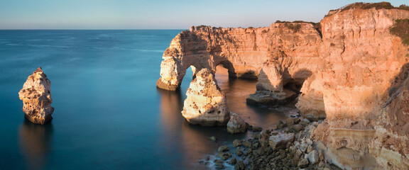 Sunny day in the Beach at Algarve, Portugal with turquoise sea in background. Bird eye view of the...