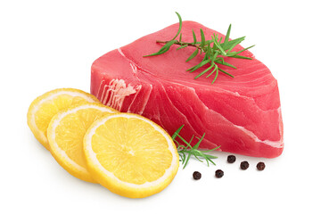 Fresh tuna fish fillet steak with rosemary, lemon and peppercorns isolated on white background with...
