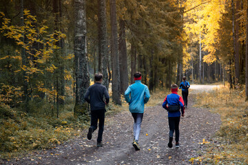 People are running in the forest, in the park.Fitness on the street.