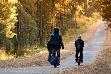 Monowheel.People ride a monowheel in the autumn park. © Александр Поташев