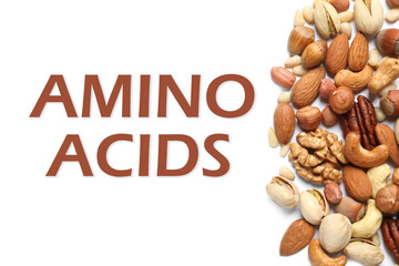 Different delicious nuts on white background, flat lay. Sources of essential amino acids