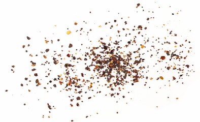 Aromatic spicy chili pepper flakes, dry ancho chili pile isolated on white background, top view