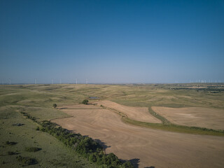Aerial drone image of Farmland and wind turbines in the state of Kansas