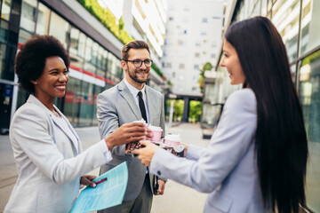 Business young team discuss outdoor, coffee break.
