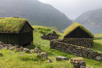 Sunny morning view of typical turf-top houses. Panoramic summer scene of Streymoy island, Denmark, Europe.Torshavn Faroe Islands, Kingdom of Denmark, Europe. Traveling concept background. 