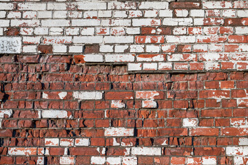 Old brick wall of bricks of different textures as the background