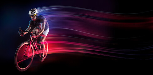 Spost background with copyspace. Cyclist. Dramatic colorful portrait. Speed and powerfull.
