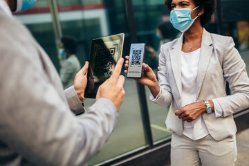 Woman traveler using digital vaccination certificate for travel during covid-19 pandemic.