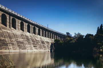 Dam on the river, autumnal concrete structure bridge in La Florida, San Luis, Argentina