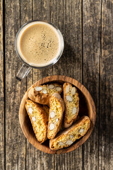 Italian cantuccini cookies and coffee cup. Sweet dried biscuits with almonds