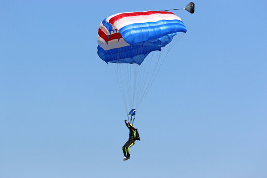 Skydiver in a blue sky	