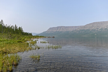 Putorana Plateau, a misty haze over the lake.