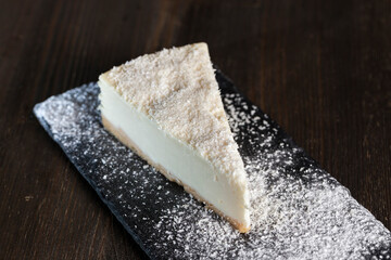 dessert cheesecake covered with dried coconut pulp