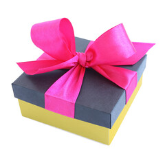 Yellow gift box with pink satin ribbon bow isolated on white