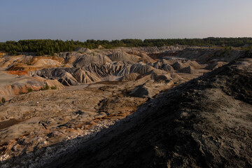 The clay quarry resembles a cosmic landscape.Ural Mars.An original landscape in the Sverdlovsk region in Russia.Top view of the hills made of refractory clay.A unique place created by man and nature