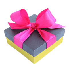 Yellow gift box with pink satin ribbon bow isolated on white