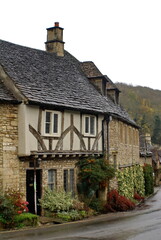 Fototapeta na wymiar Houses in the historic section of Castle Combe, by the Bybrook River, in Wiltshire, England