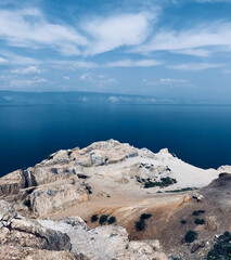 Sandy mountains overlooking the blue sea