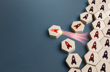 Red rocket takes off from ordered structure of others. Blast off. Startup success, breakthrough...
