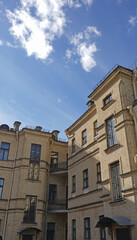 The yard of a corner brick house.