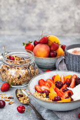 Healthy breakfast with granola, yogurt, fresh berries and coffee