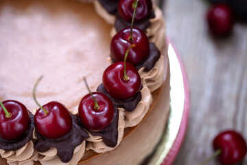 Delicious homemade chocolate cheesecake decorated with fresh cherry
