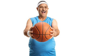Smiling mature man shwoing a basketball in front of camera