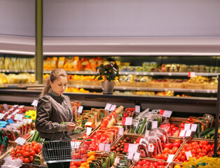 Woman buying vegetables at the market