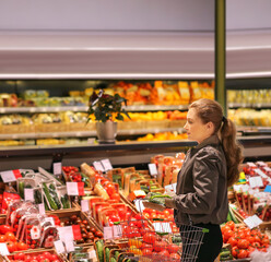 Woman buying vegetables at the market