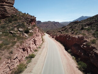 desert road in reddish mountain