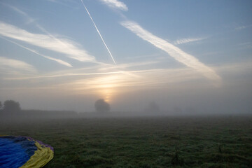 Aircraft contrails .Foggy morning in the Wiltshire countryside 