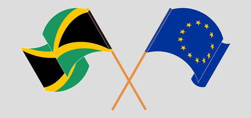 Crossed and waving flags of Jamaica and the European Union