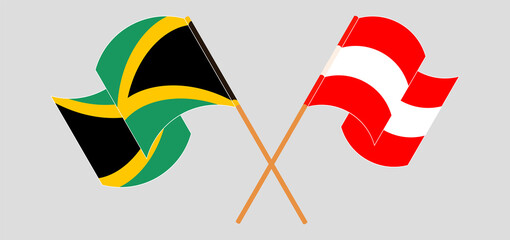 Crossed and waving flags of Jamaica and Austria