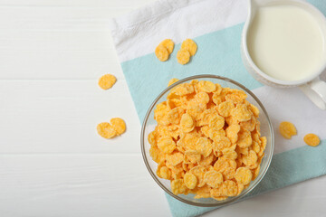  Crispy cornflakes with milk for breakfast on the table close-up.