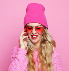 Fashion happy cool smiling girl talking on smartphone