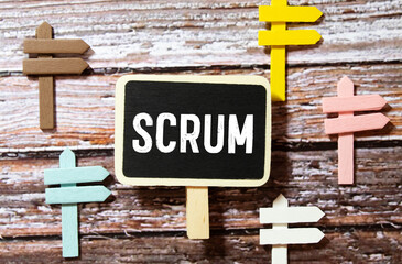 scrum. text on white paper over torn paper background.