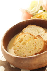 sliced French bread in egg wash for French toast cooking image