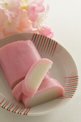 Japanese food, pink and white fish cake on dish for food ingredient image