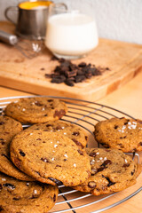 Organic food snack tasty sweet dessert milk dark chocolate chip salt cookie closeup piece fruit orange raspberry hazelnut nuts cinnamon on cocoa cacao powder wooden table for new year Christmas gift