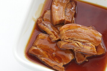 Chinese food, braised pork belly sliced on boiled green leaves vegetable