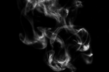 White steam smoke on solid black background with abstract blur motion wave swirl use as an overlay effect for vapor cigarette dry ice hot water and food soup