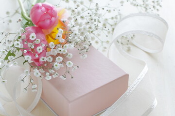 pink gift box and ribbon with turnip flower 