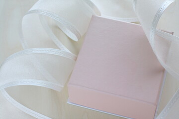 Pink gift box and ribbon with copy space