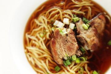 Chinese food, braised pork belly and egg noodles in soup for homemade comfort food