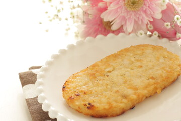 American breakfast, hashed brown on white dish with fork
